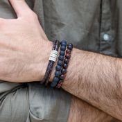 set of bracelets for men. Unique combination of beaded bracelets with engraved leather bracelet 