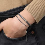 Name bracelet with Sterling Silver engraved charms.Crafted in Gray Suede