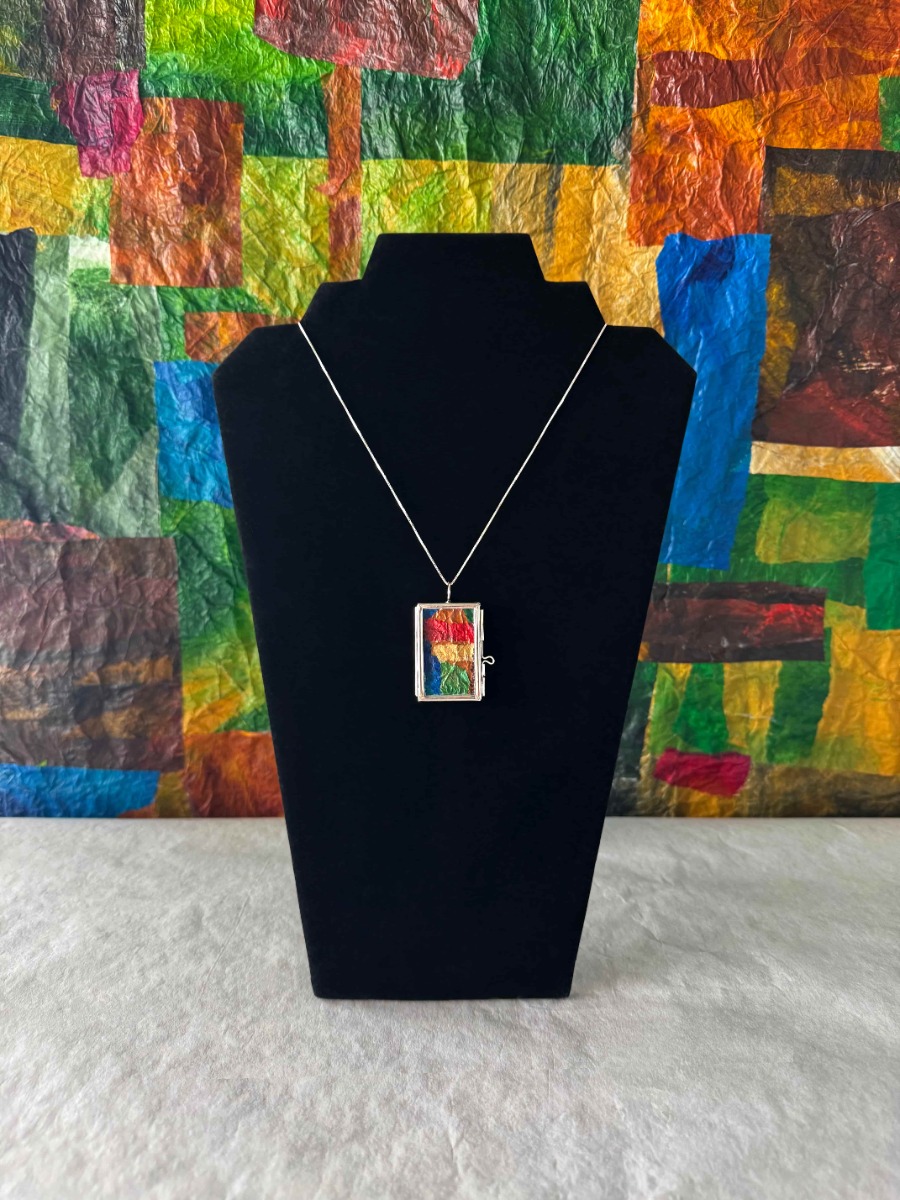Aura Fragment Locket featured on a mannequin