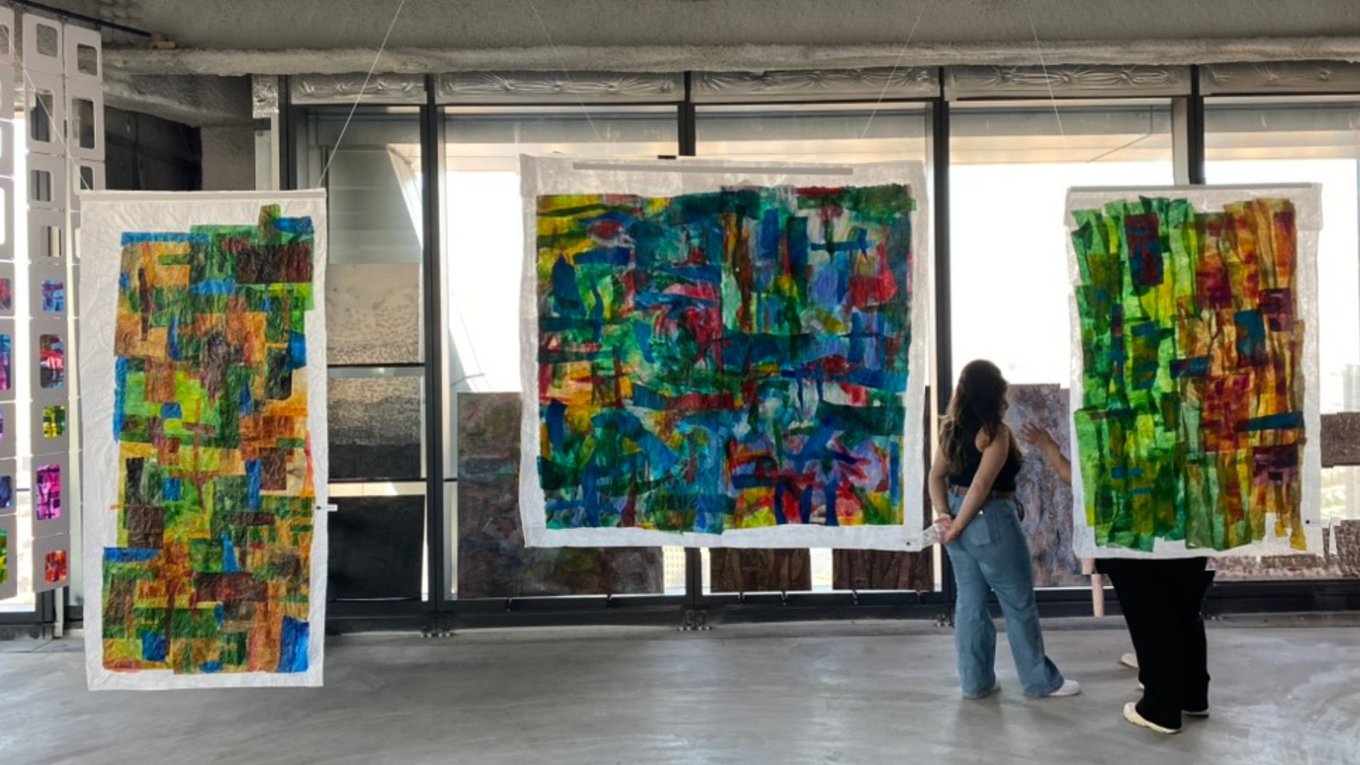 Michelle Shassberger with her large-scale tissue paper artworks in the studio